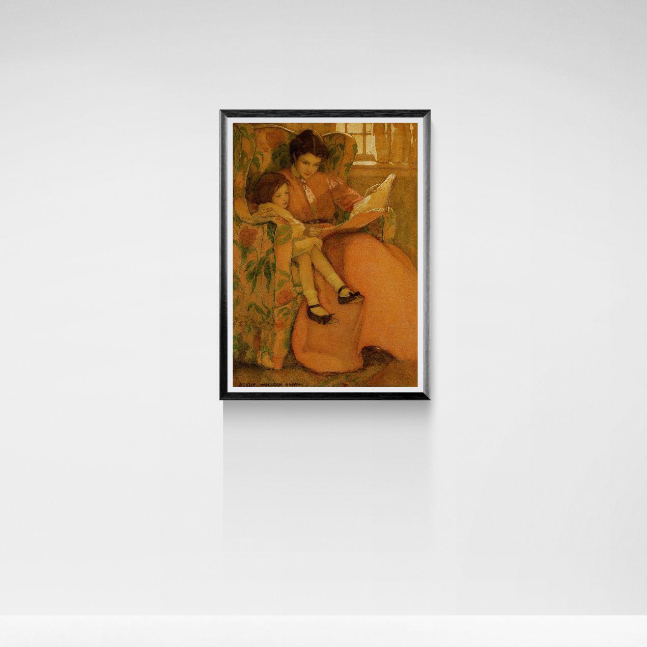 Framed artwork of a woman reading to a child on a white wall