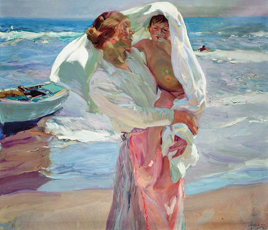 Museum-quality Giclée reproduction of Joaquín Sorolla's 1900s "After Bathing" painting, featuring a mother holding a child wrapped in a large white towel on a sun-drenched beach with crashing waves. Ideal for coastal or light-filled decor.