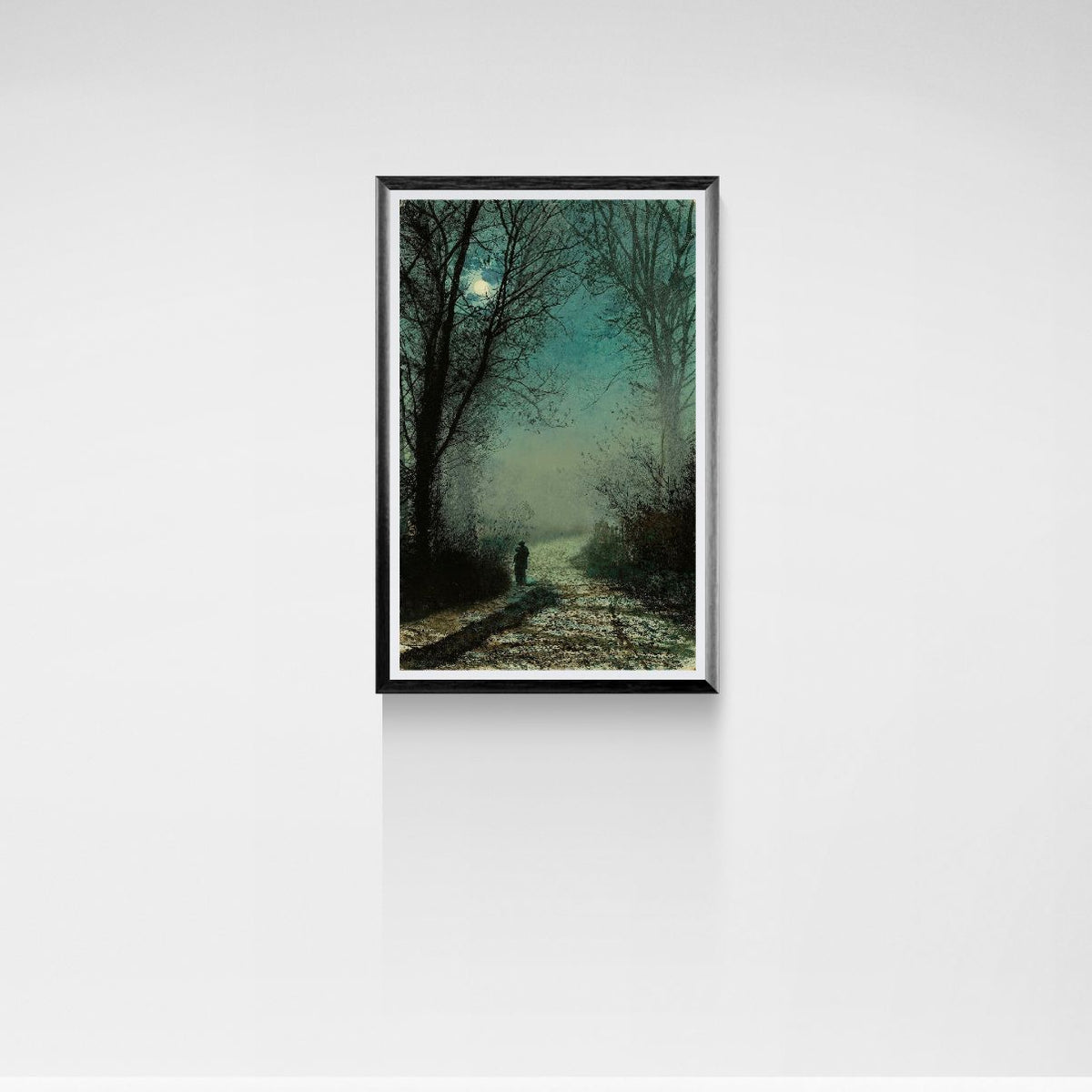 Framed artwork of a person walking along a path in a forest with a moonlit sky.