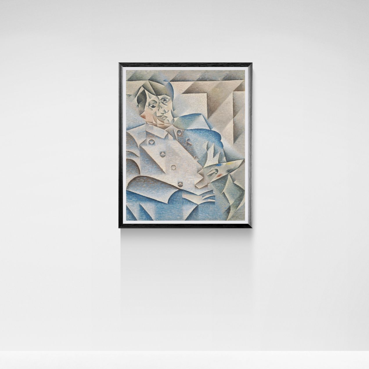 Framed artwork of a stylized portrait on a white wall