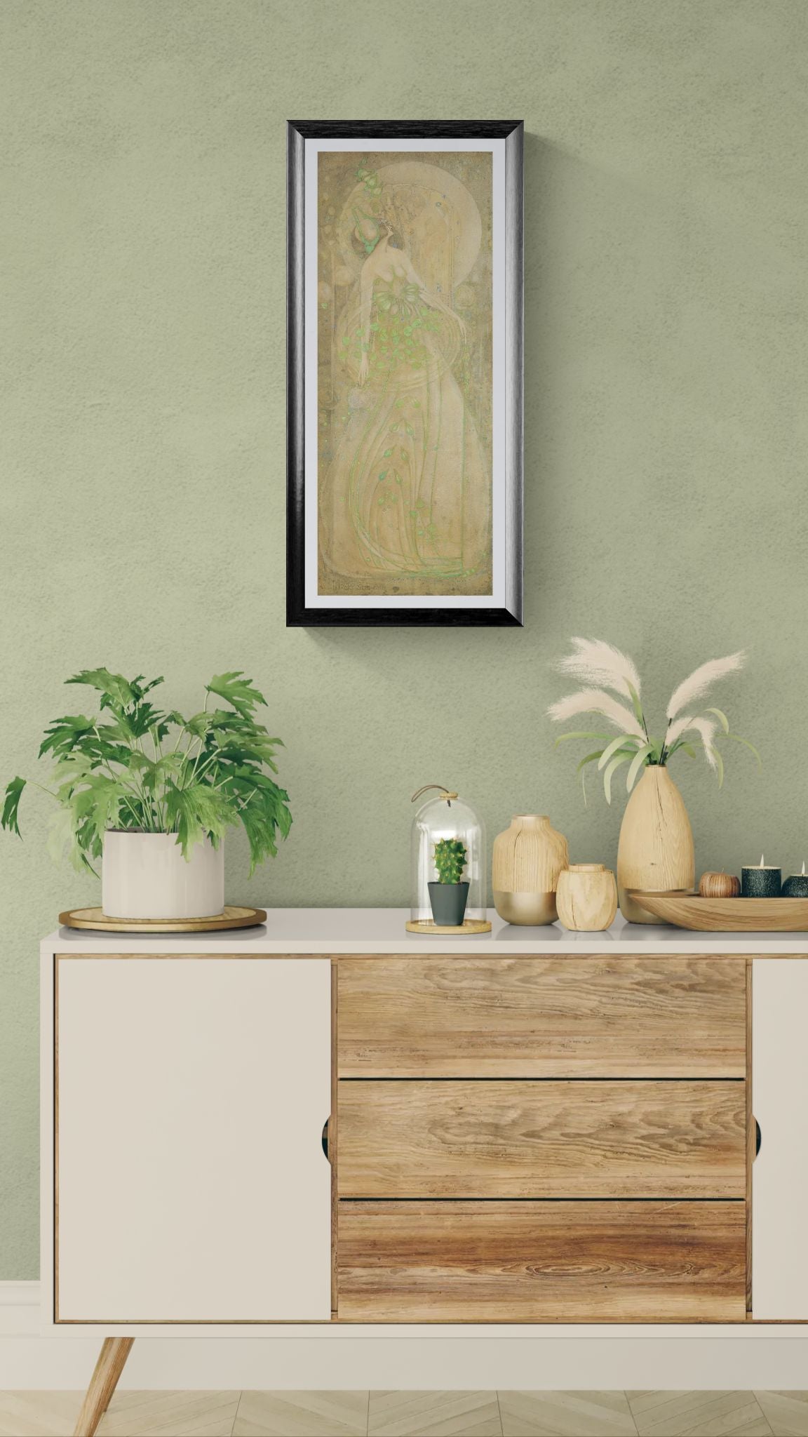 Decorative setting with a framed painting, plants, and a wooden cabinet against a green wall.