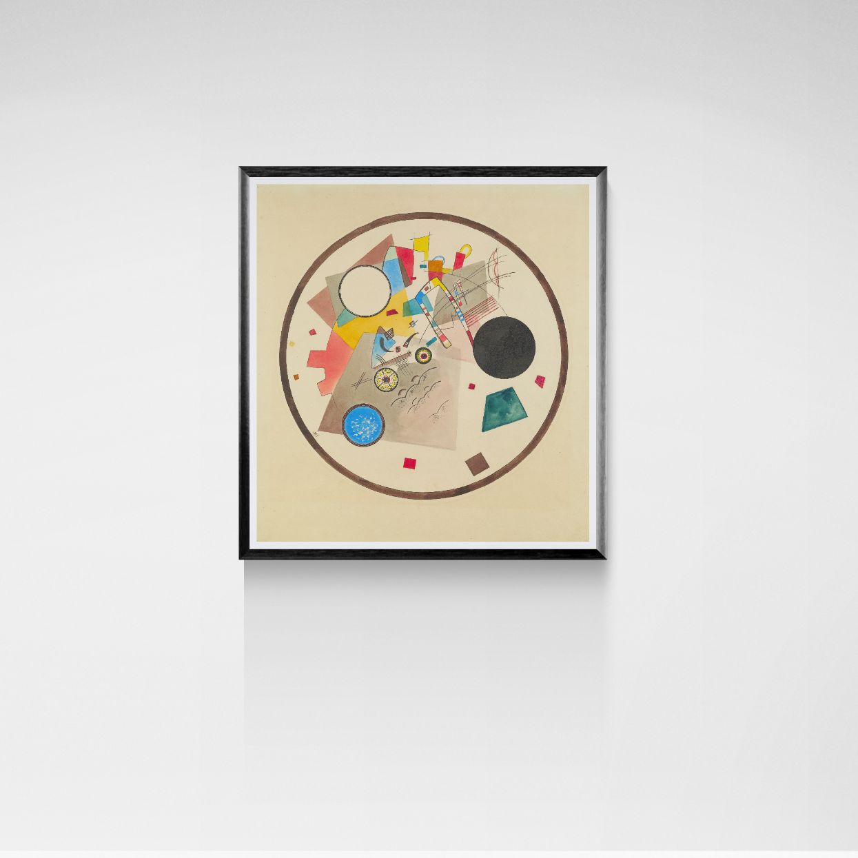 Framed abstract art piece on a white wall