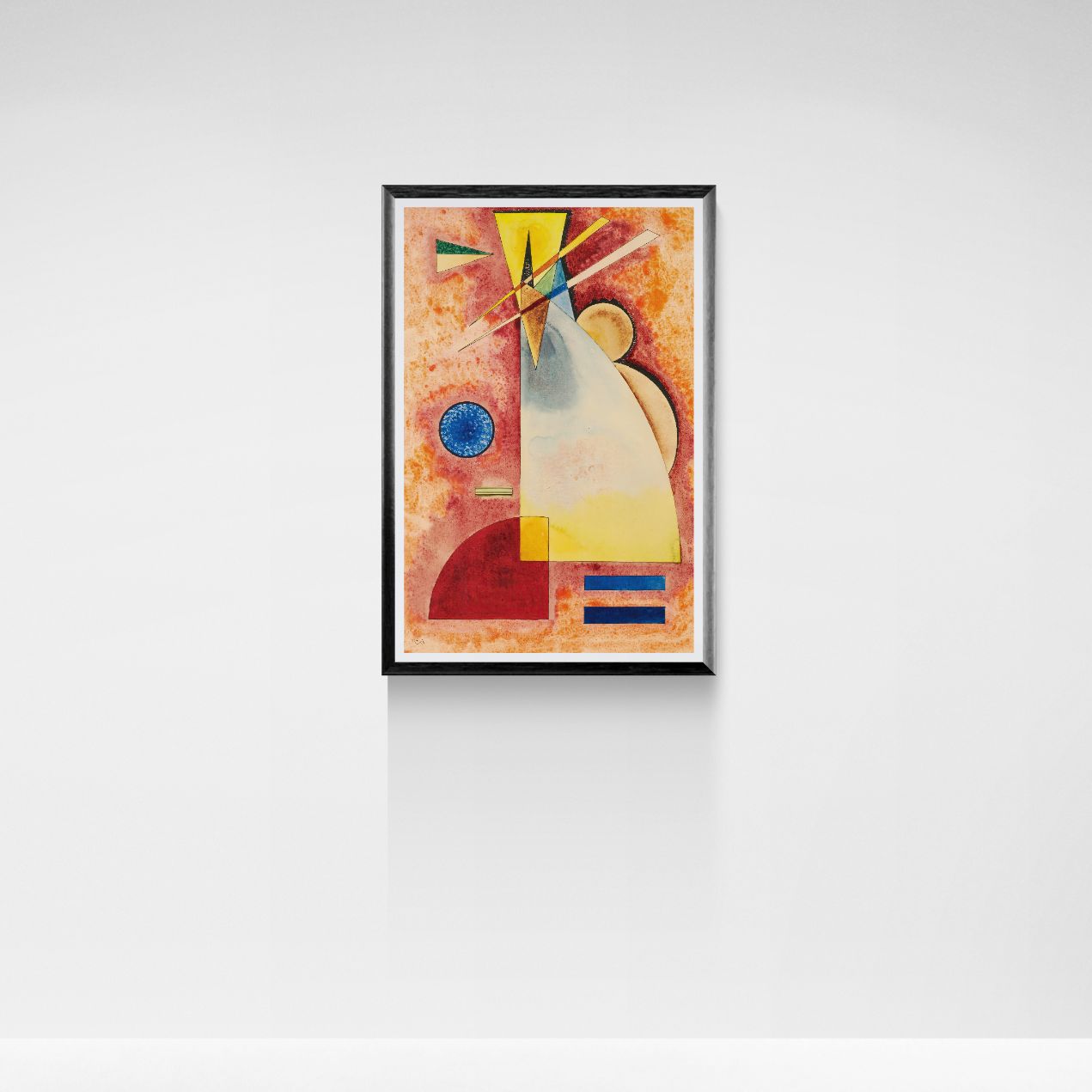 Framed abstract artwork with geometric shapes on a white wall