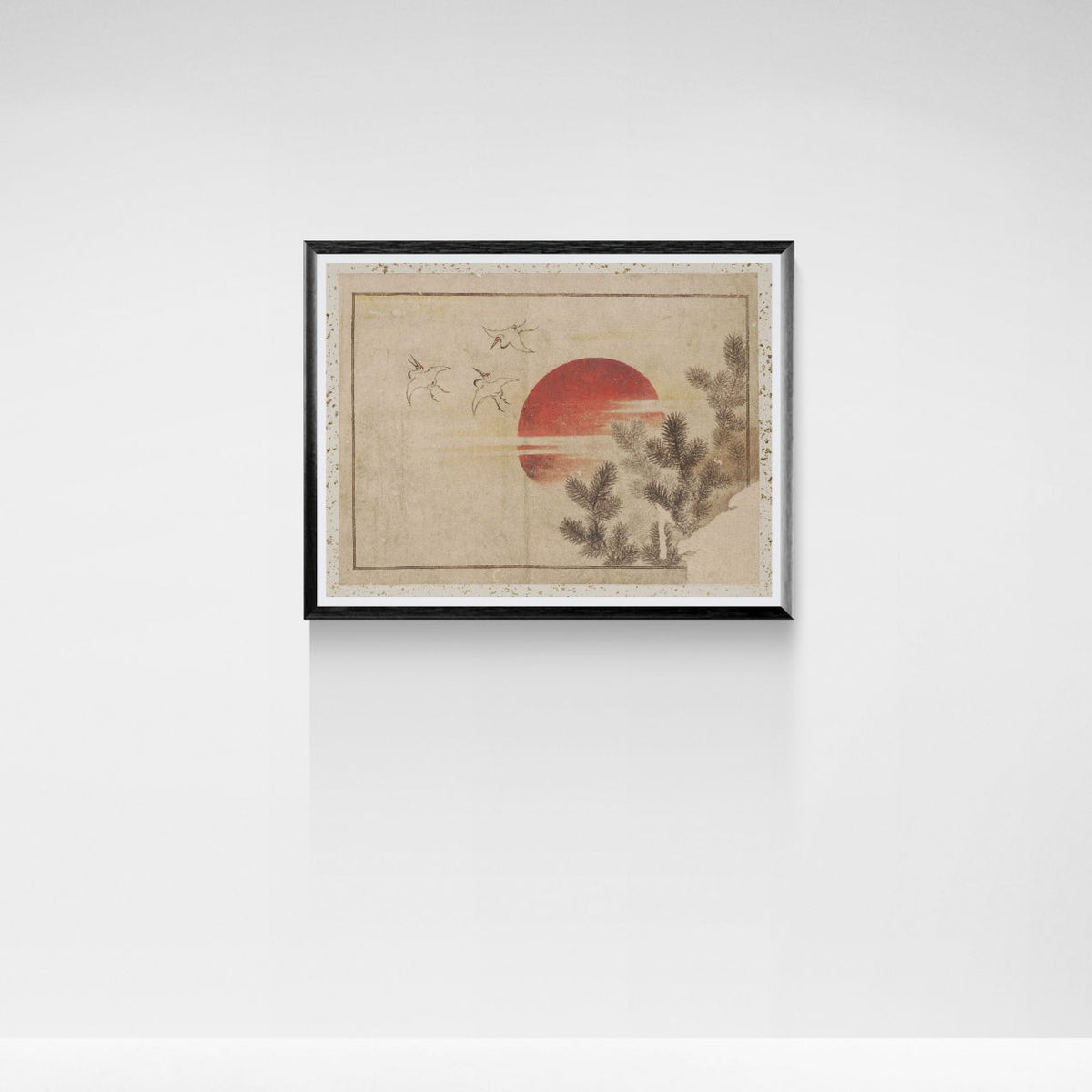 Framed artwork with a sunset and tree design on a white wall