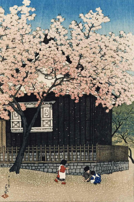 A Japanese-style artwork showing a dark wooden house beneath a large blooming pink cherry blossom tree, with two children standing near the fence in front. The scene includes a blue sky and beige ground.