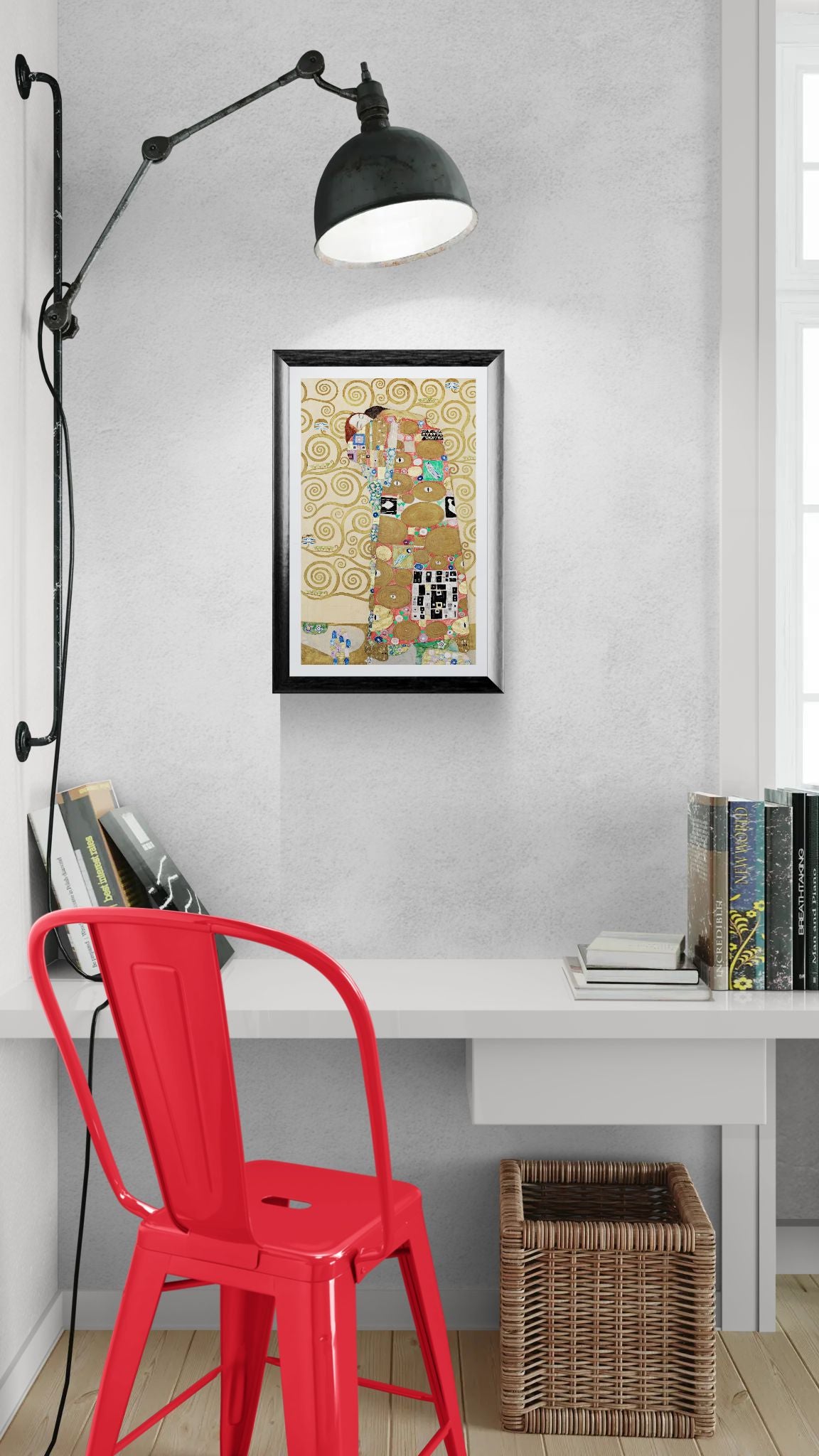 Modern interior with a red chair, white desk, and framed artwork on a gray wall.