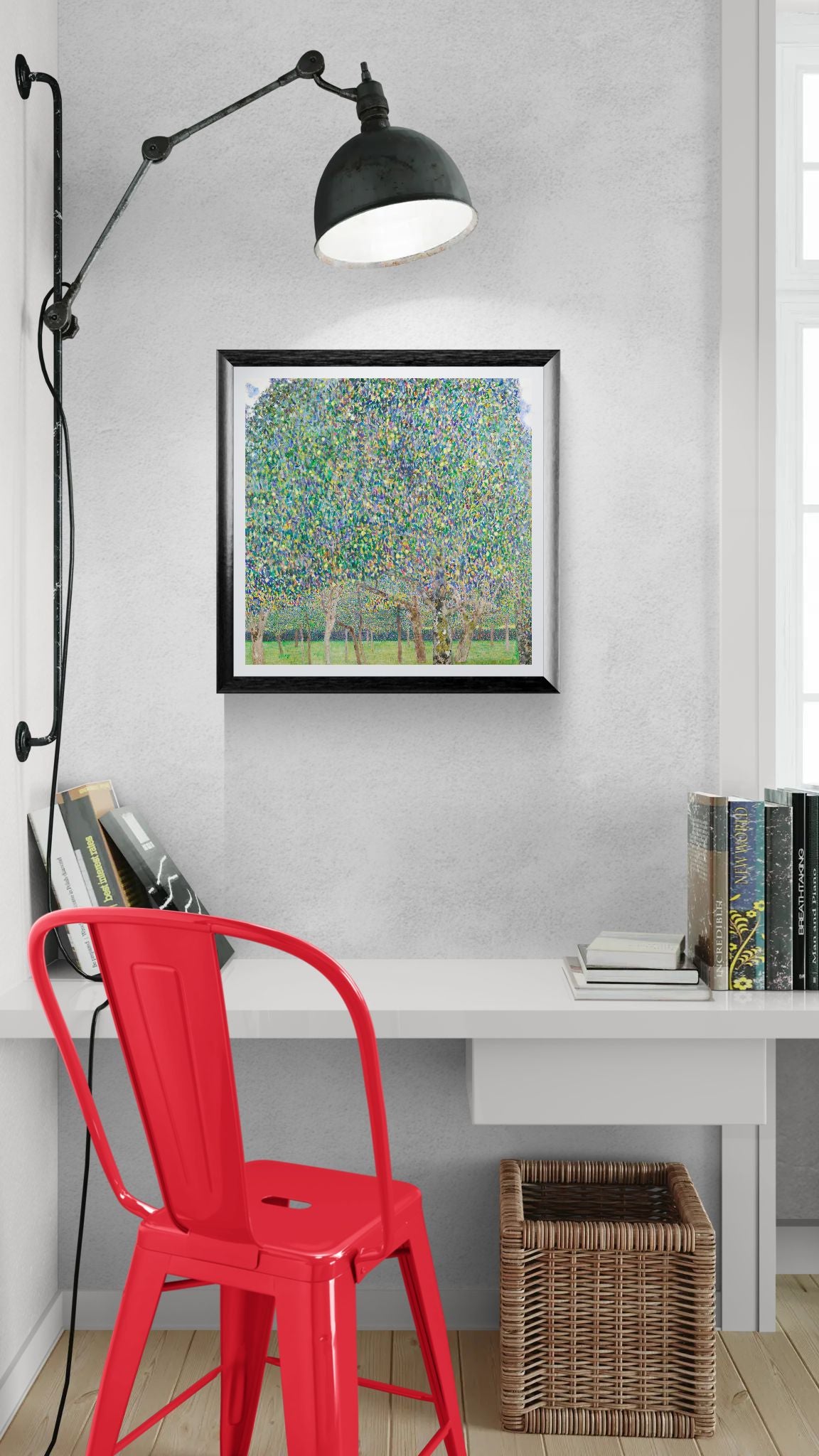 Modern interior with a red chair, white desk, and framed artwork on a gray wall.