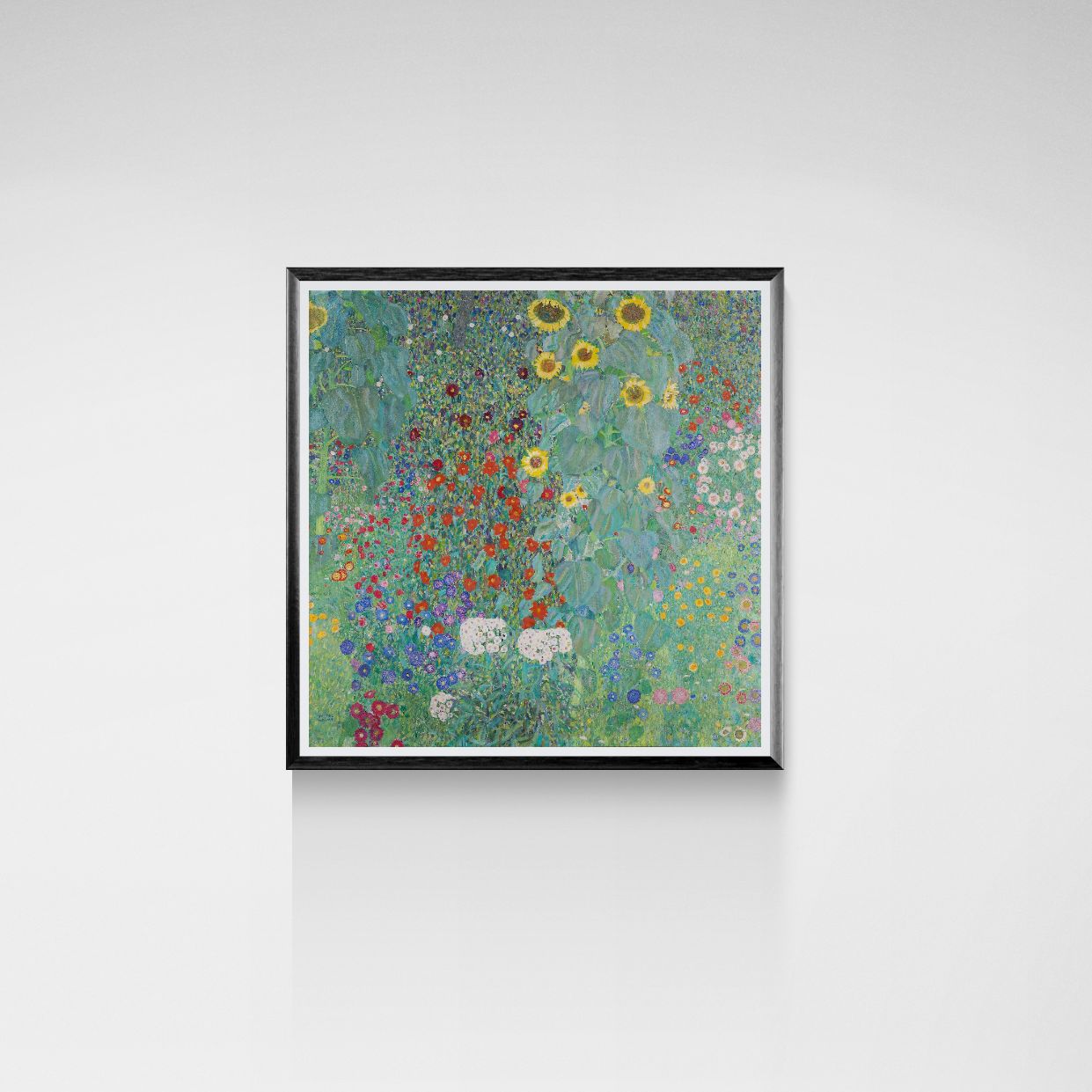 Framed artwork of a colorful floral design on a white wall