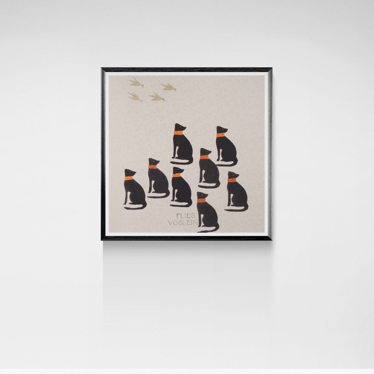 Framed artwork with illustrations of cats on a beige background