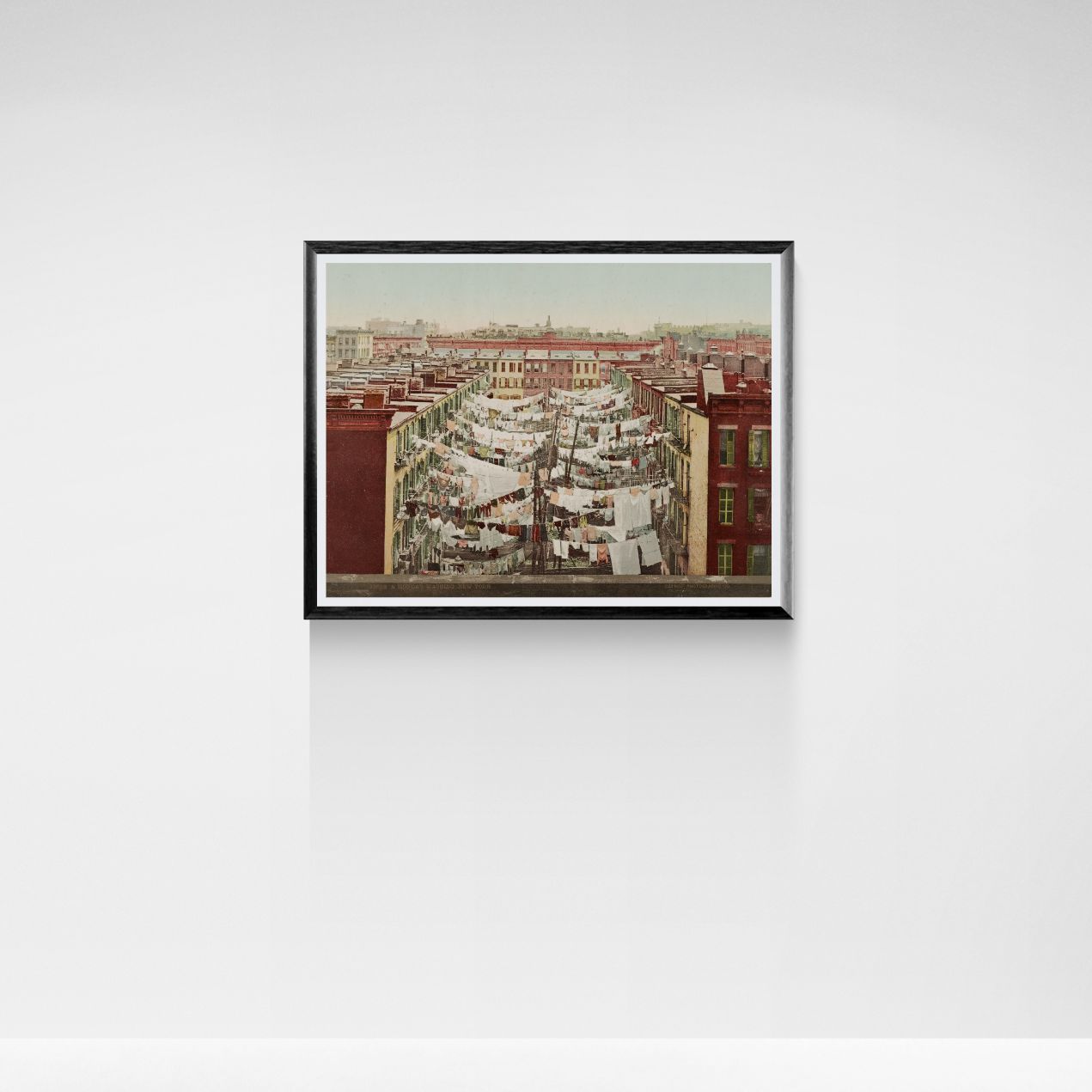 Framed artwork of a New York cityscape on a white wall