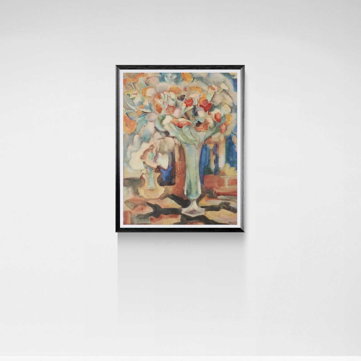 Framed artwork of a floral still life on a white wall