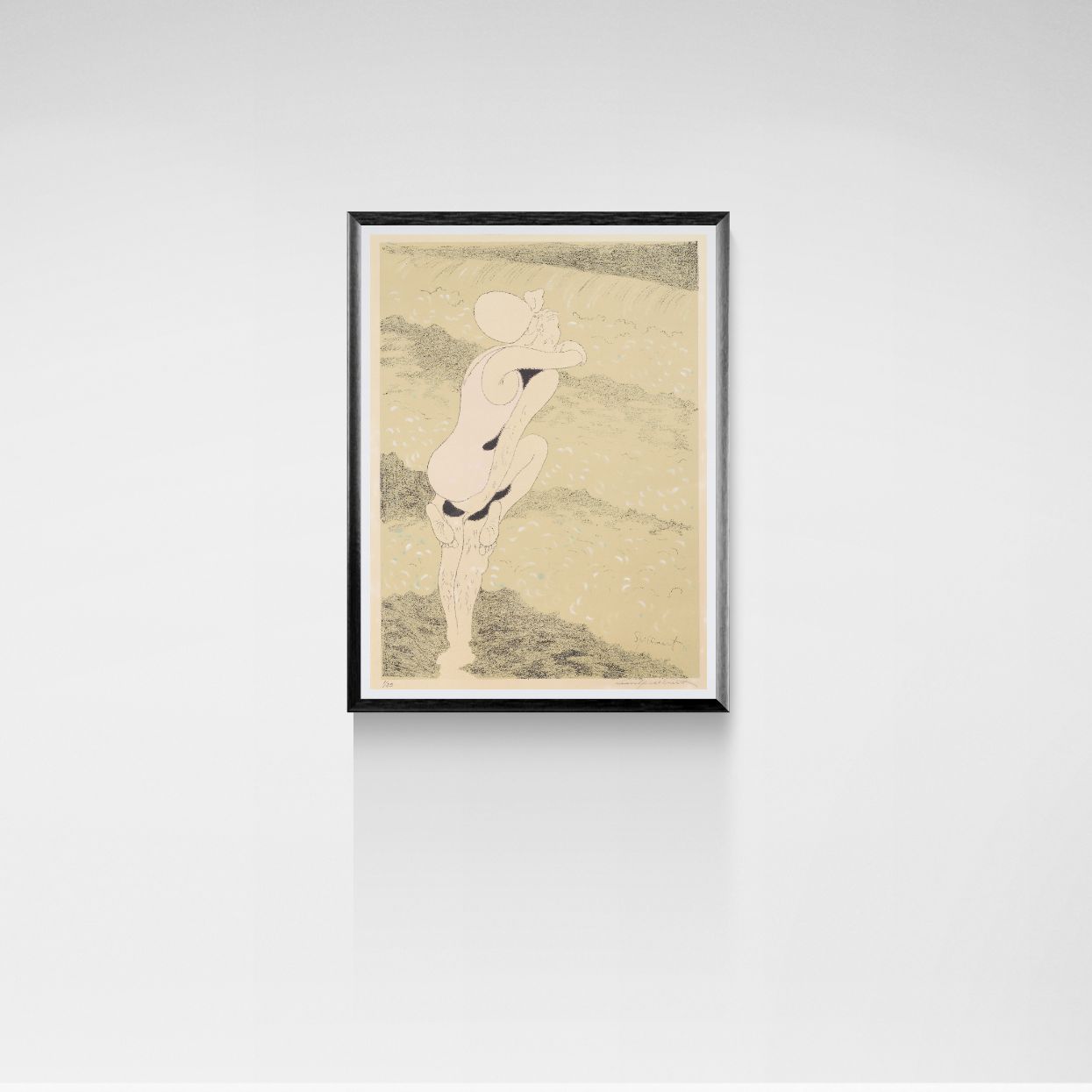 Framed artwork of two figures at the beach on a plain wall