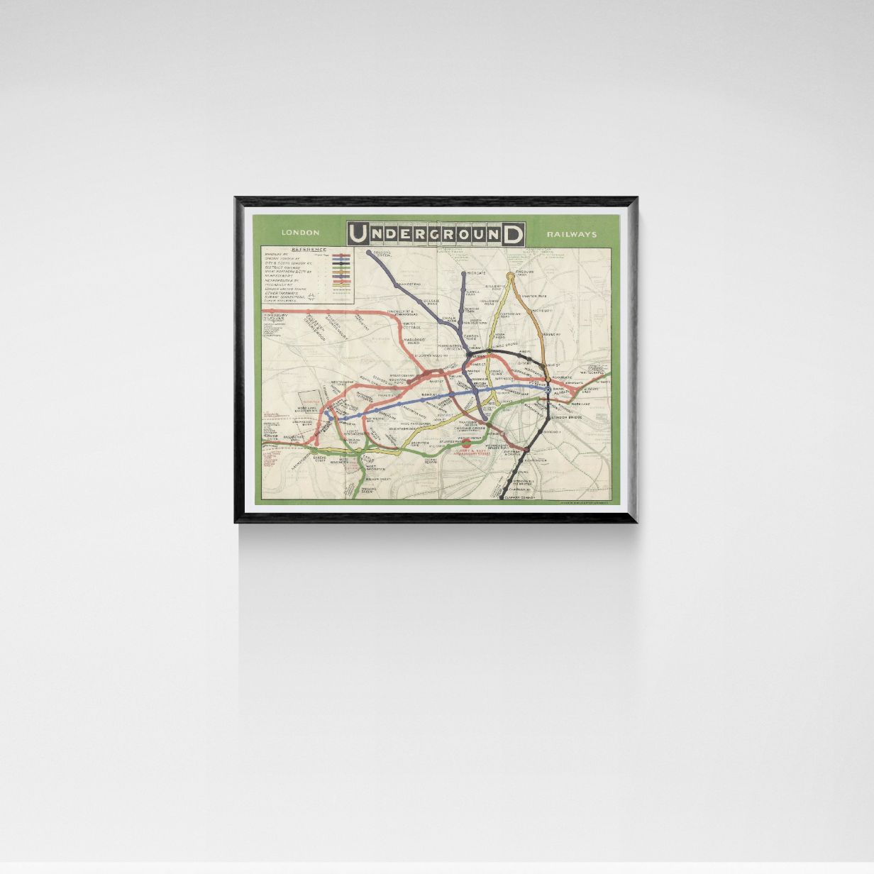 Framed map of the London Underground on a white wall