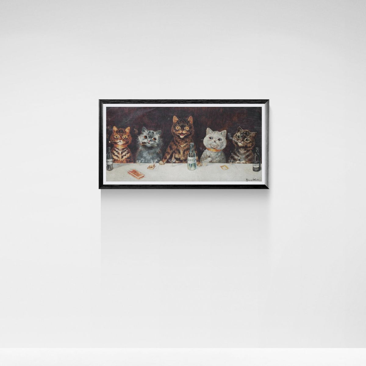 Framed artwork of four stylized cats on a white wall