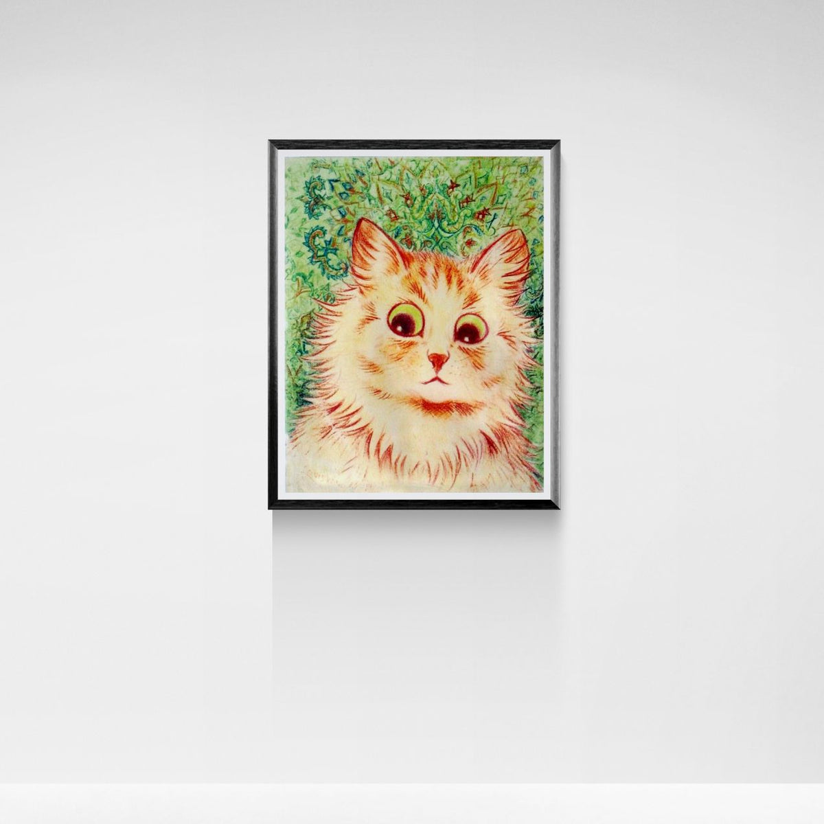 Framed artwork of a cat's face on a white wall