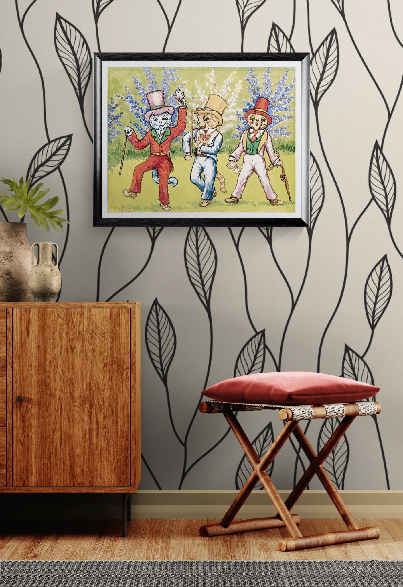 Framed artwork of three animated characters on a wall with decorative leaves.