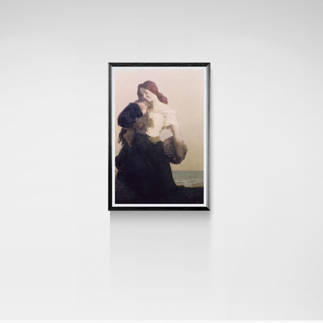Framed artwork of a woman with a child on a beach against a white wall.