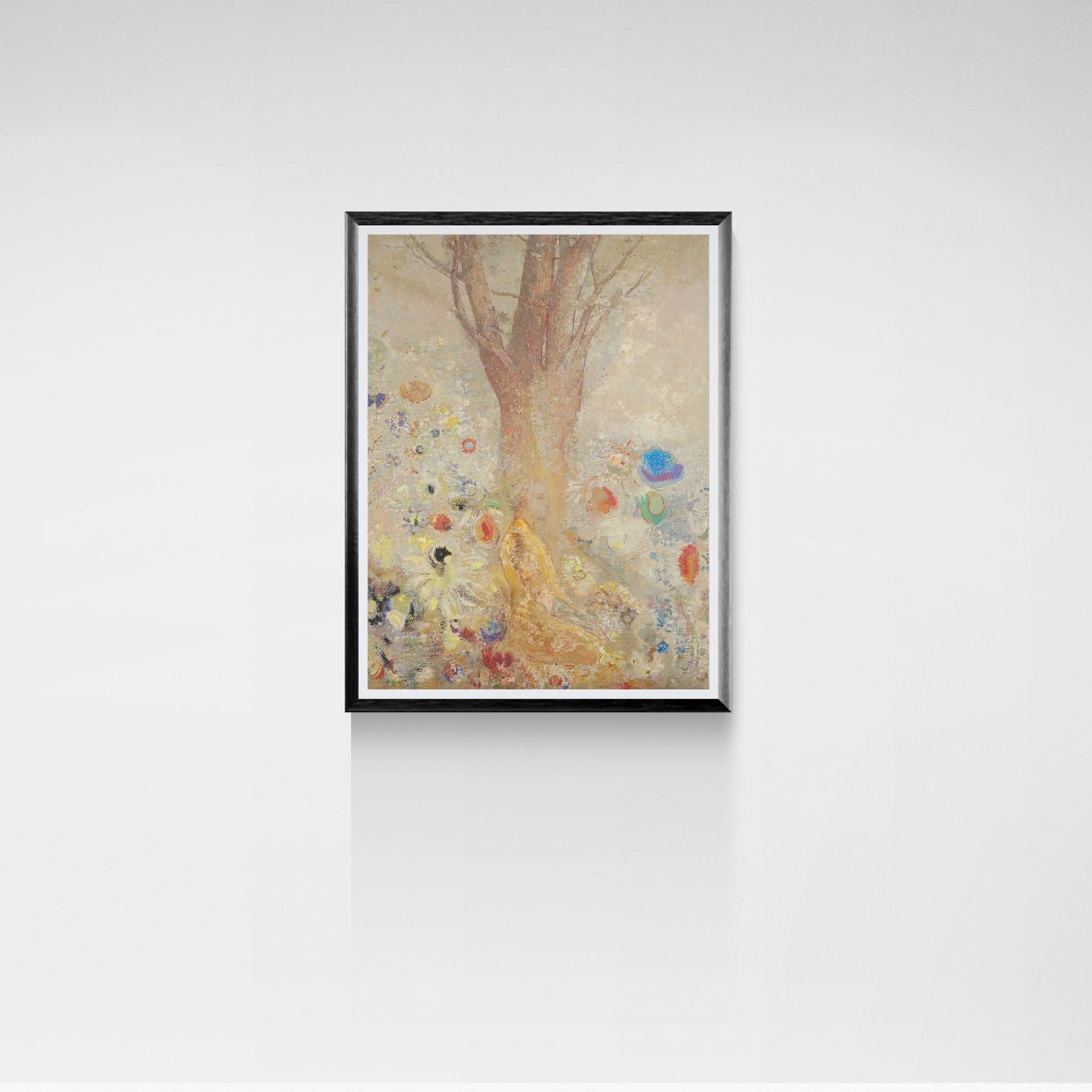 Framed artwork of a tree with colorful elements on a white wall