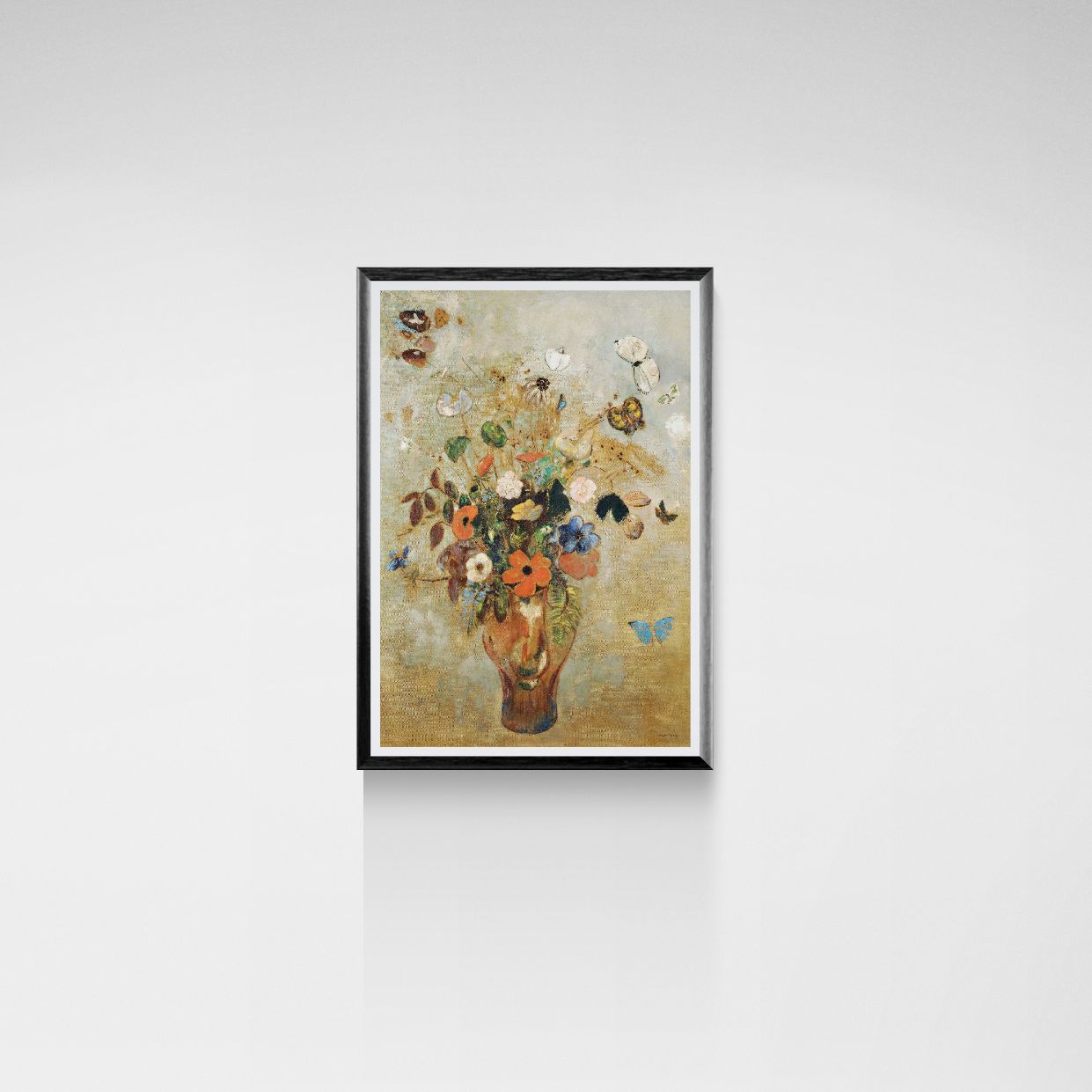 Framed artwork of a floral arrangement on a white wall