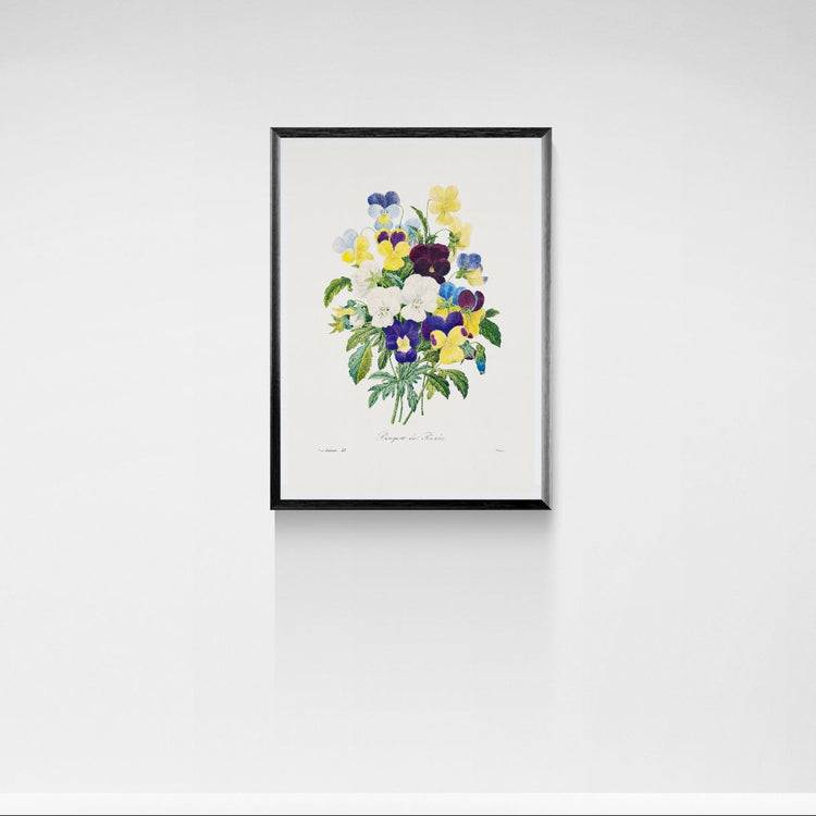 Framed artwork of a colorful floral arrangement on a white wall