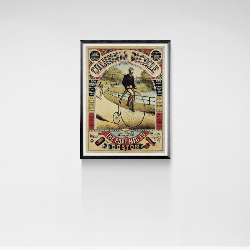 Framed vintage-style advertisement poster for Columbia Bicycle on a white wall