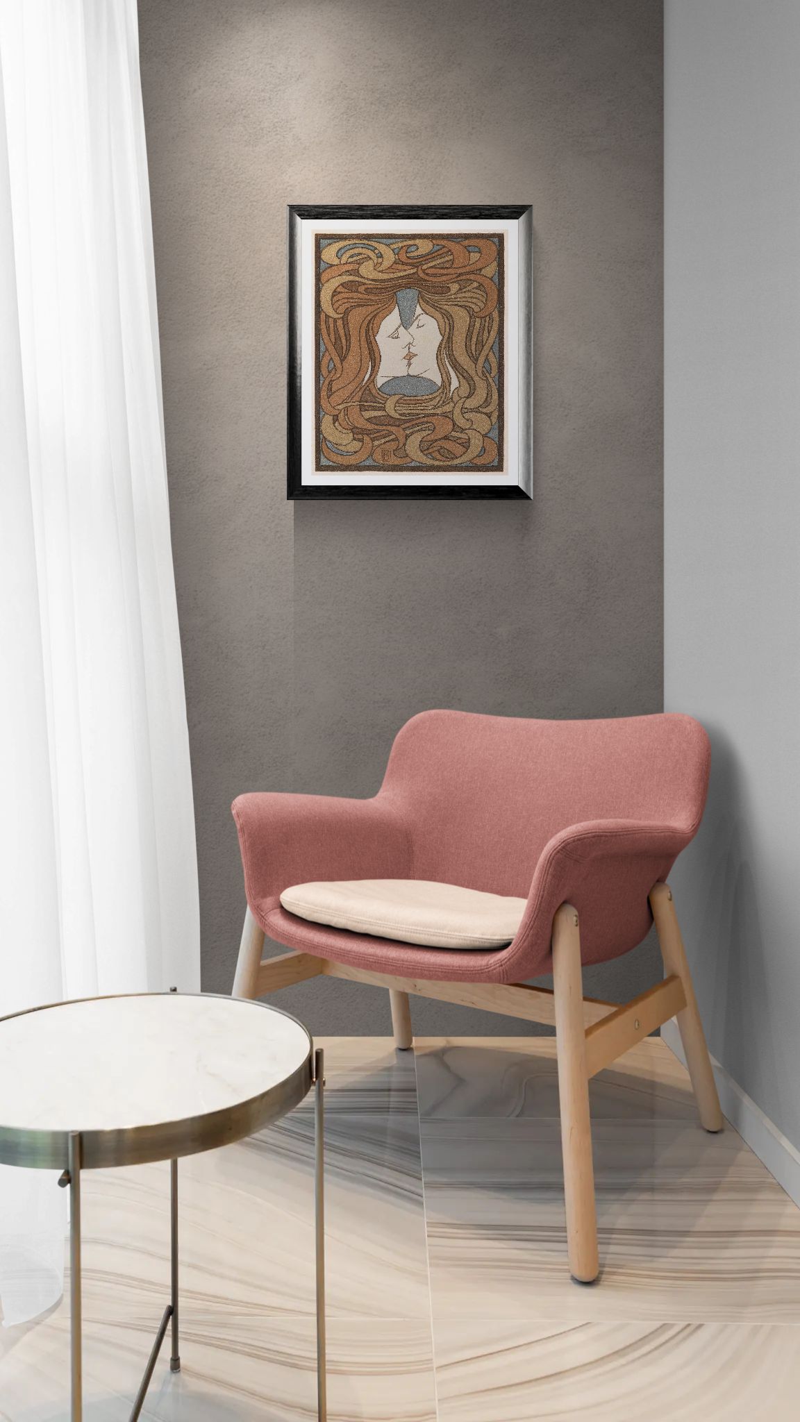 Pink armchair with wooden legs in a room with a framed artwork on the wall.