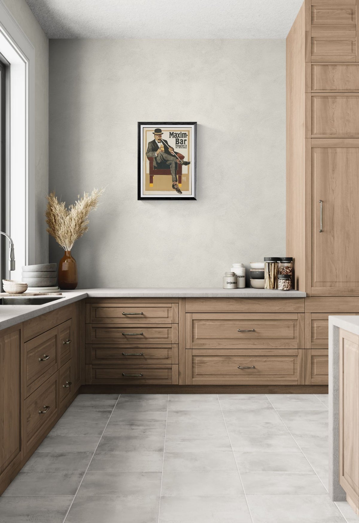 Modern kitchen with wooden cabinets, white walls, and a framed poster on the wall.