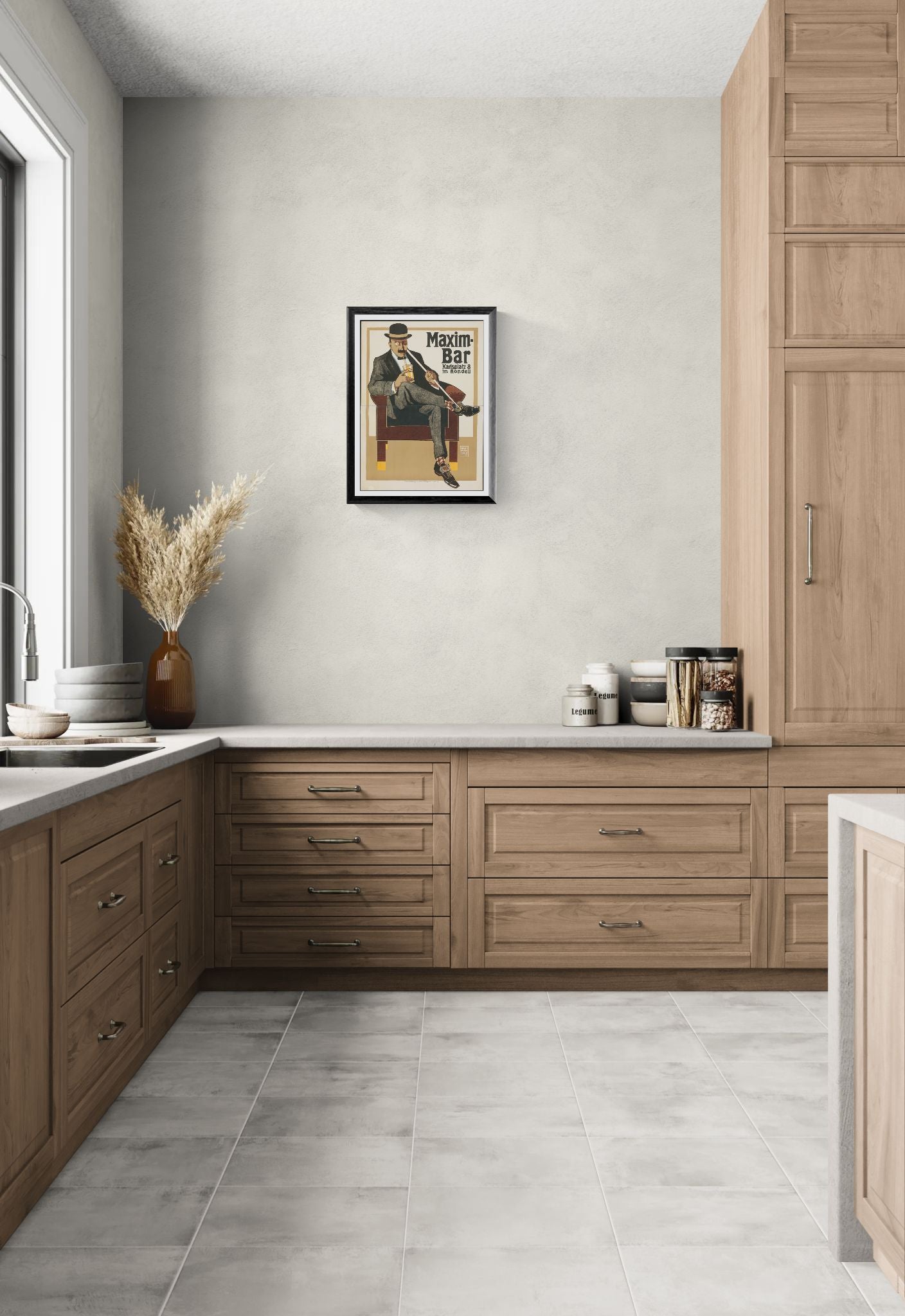 Modern kitchen with wooden cabinets, white walls, and a framed poster on the wall.