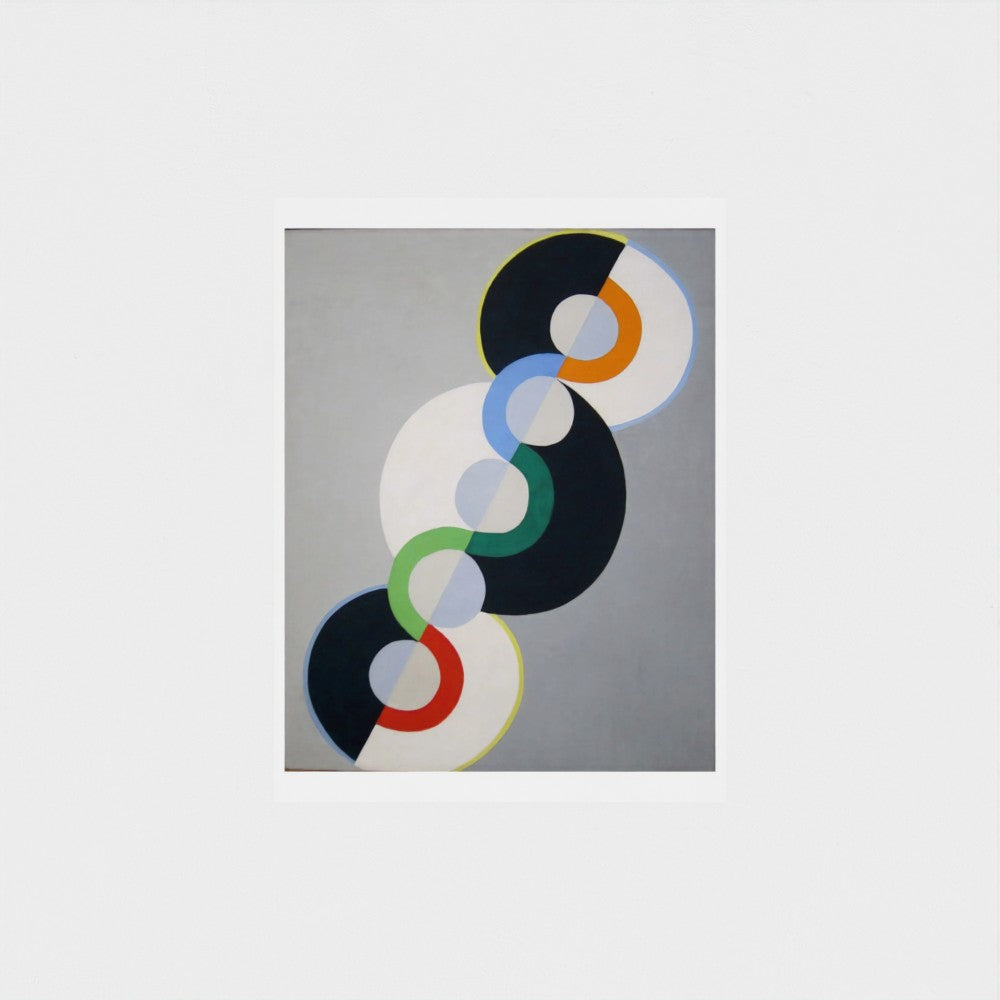 Abstract art piece with colorful circular shapes on a gray background
