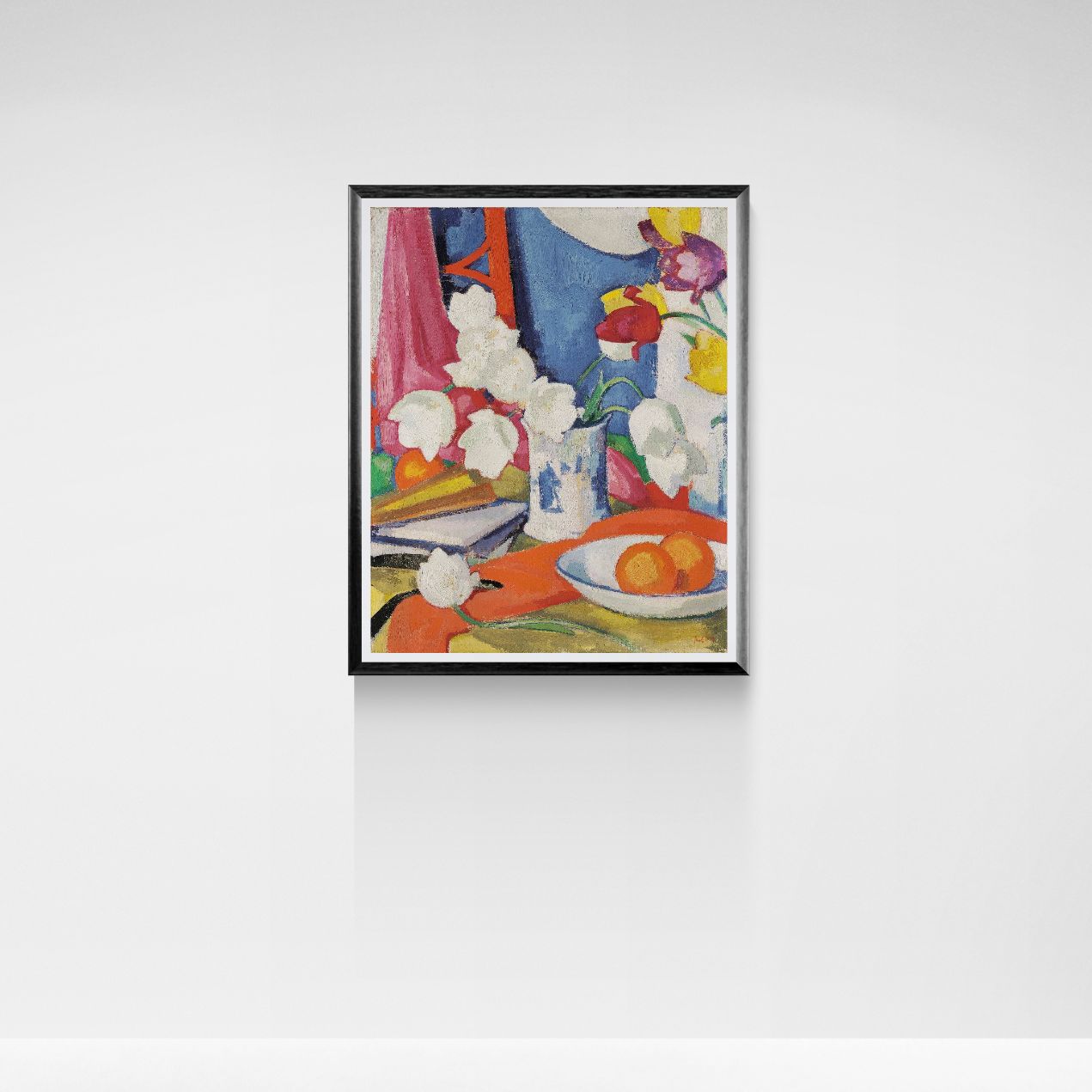 Framed artwork of a still life scene with flowers and fruits on a white wall.