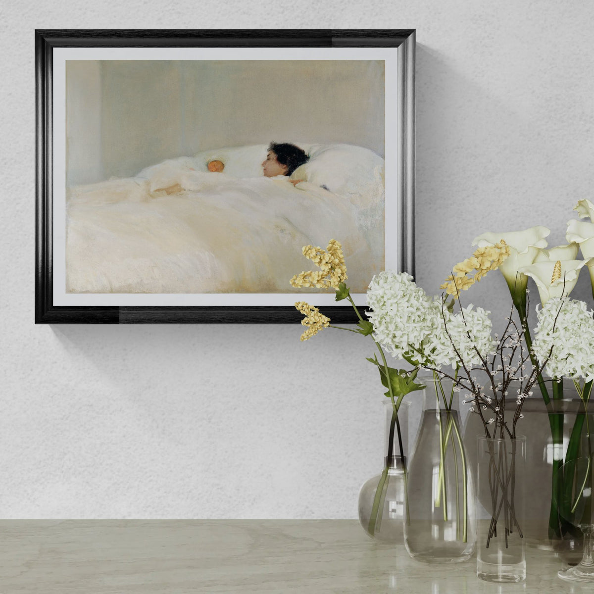 Framed artwork of a woman lying on a bed with flowers in the foreground