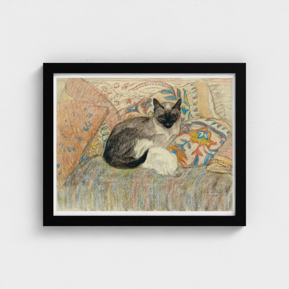 Framed artwork of a cat sitting on a patterned chair