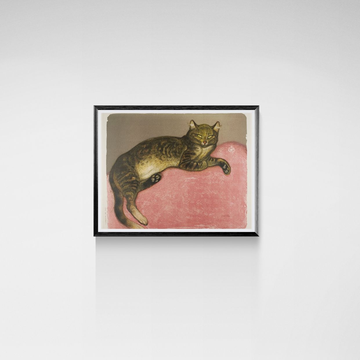 Framed artwork of a cat on a pink cushion against a white wall