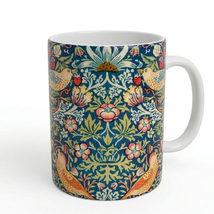 Mug with floral and bird pattern on a white background