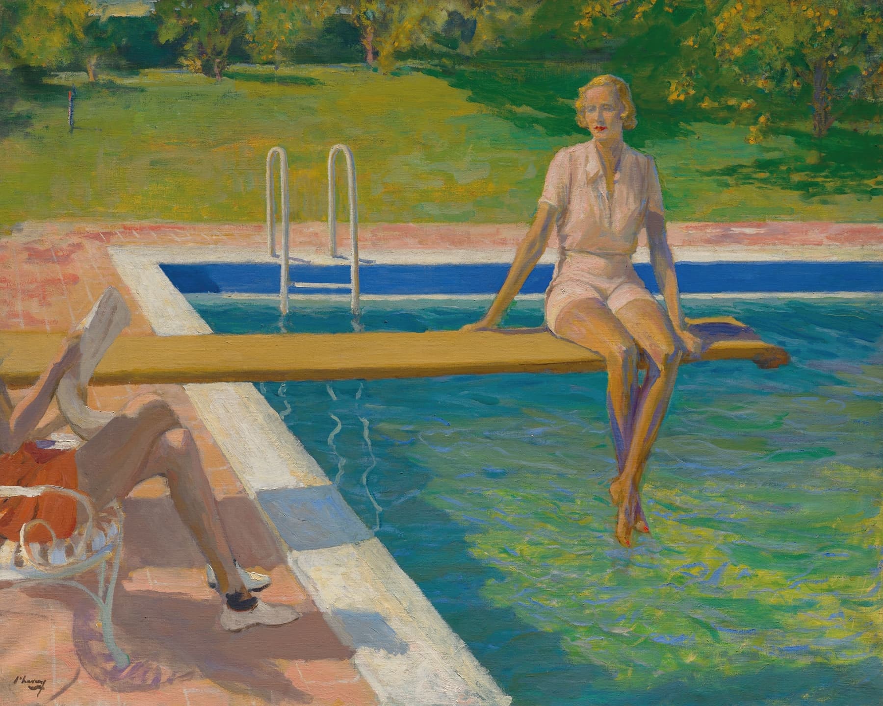 Woman sitting by a pool with a garden in the background