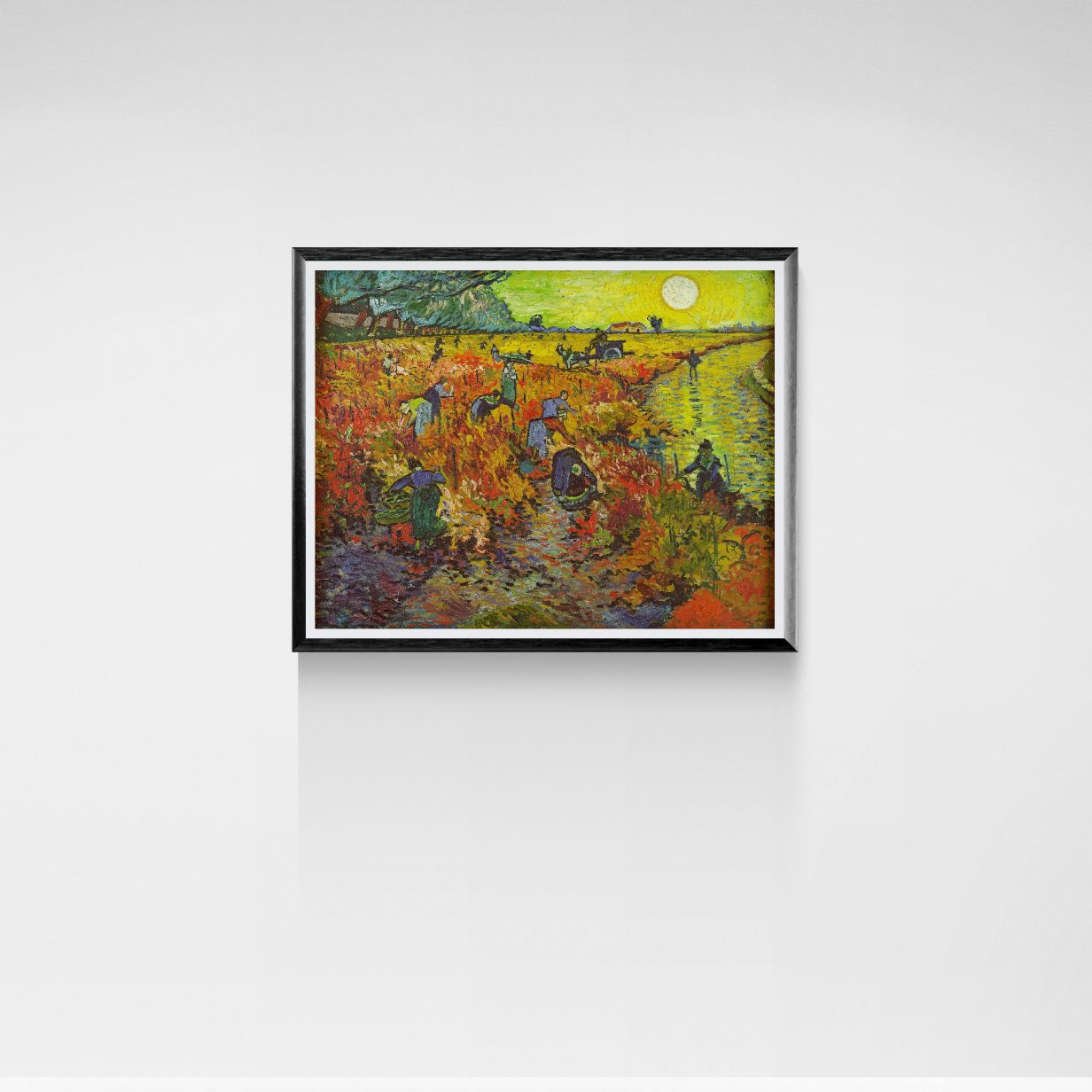 Framed painting of a landscape with people and a river on a white wall.