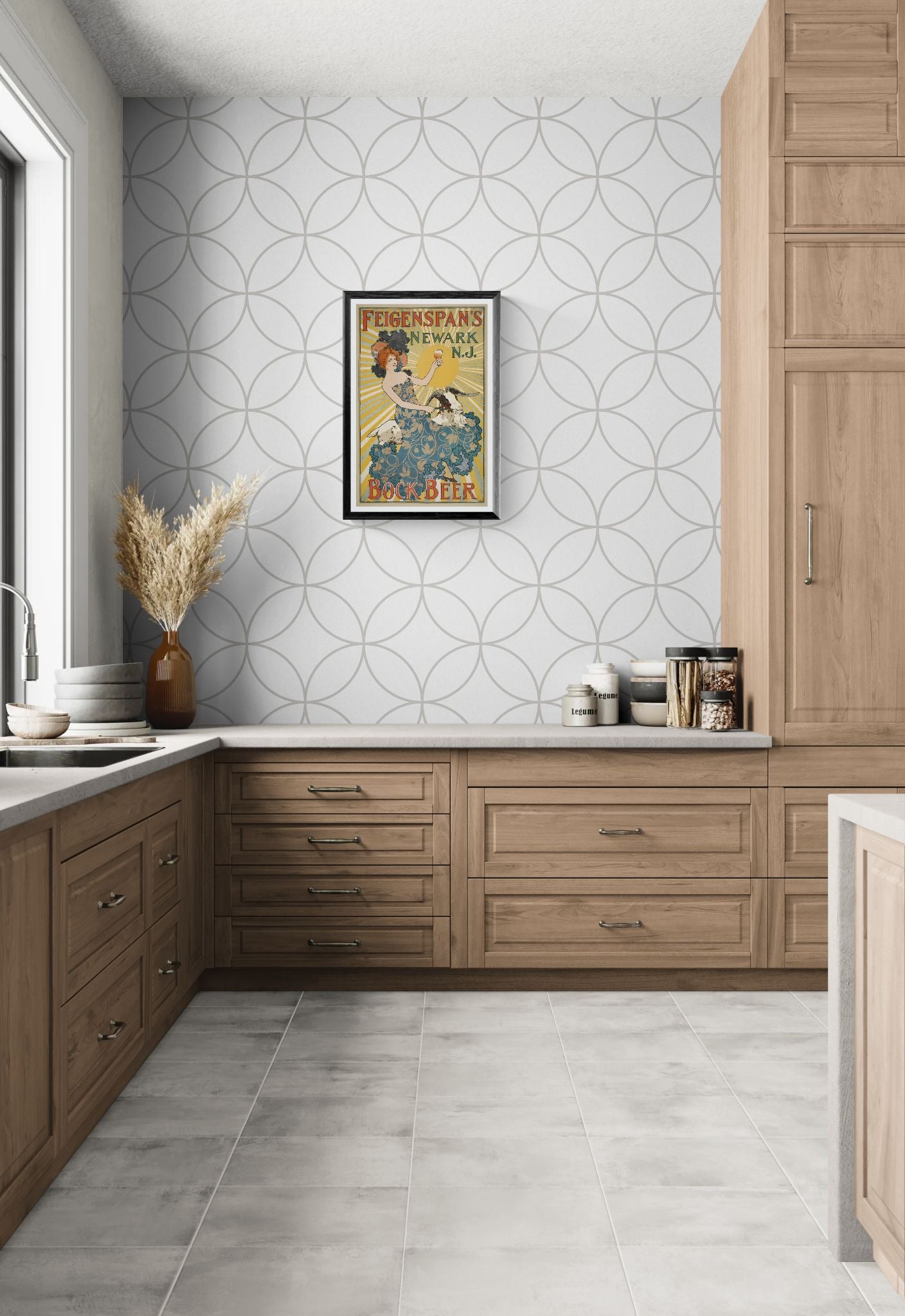 Modern kitchen with wooden cabinets, geometric wall pattern, and decorative poster.