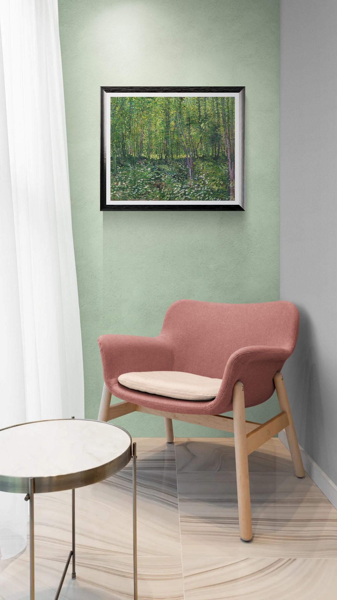 Pink chair with a white cushion in a room with a green wall and a framed picture.
