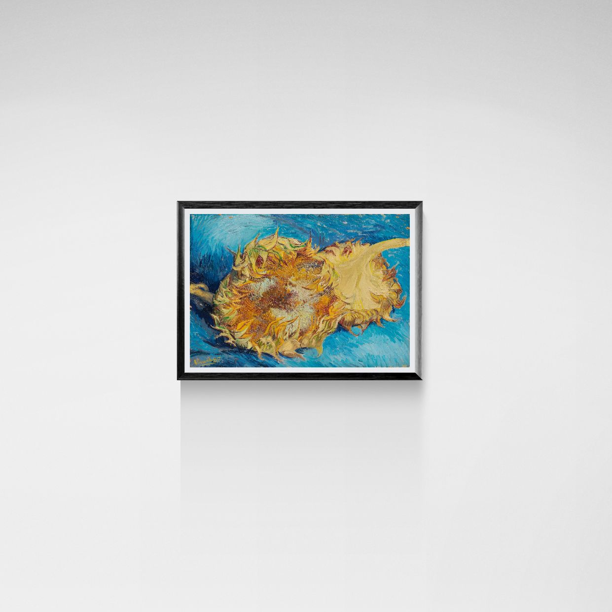 Framed artwork of sunflowers on a white wall