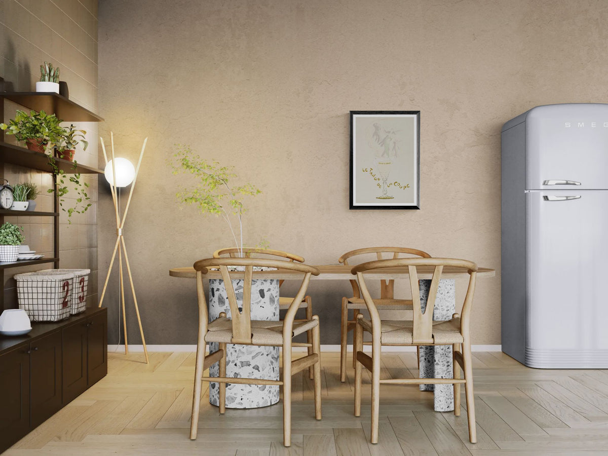 Modern kitchen with wooden dining table and chairs, gray refrigerator, and decorative elements.