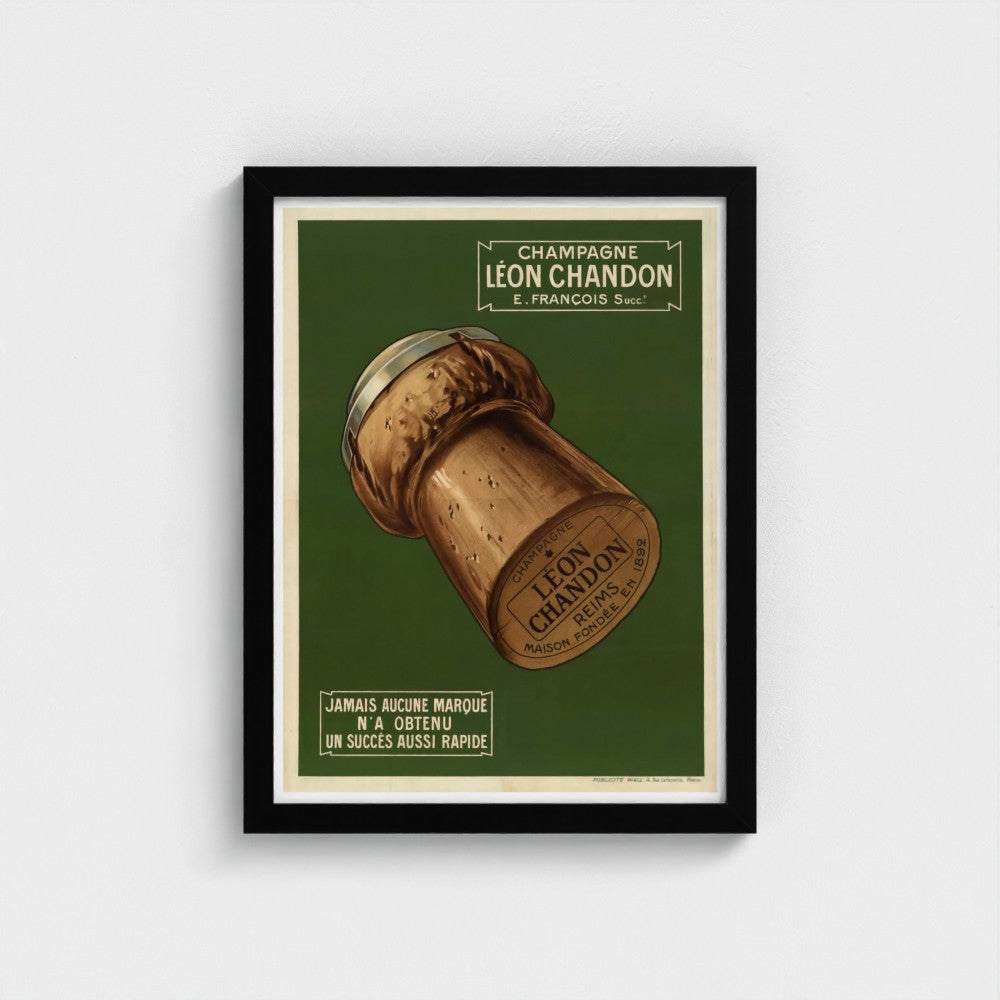 Framed poster of a champagne cork with 'Leon Chandon' branding on a green background.