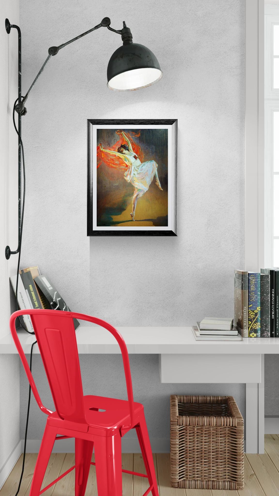 Modern interior with a red chair, white desk, and framed artwork on the wall.