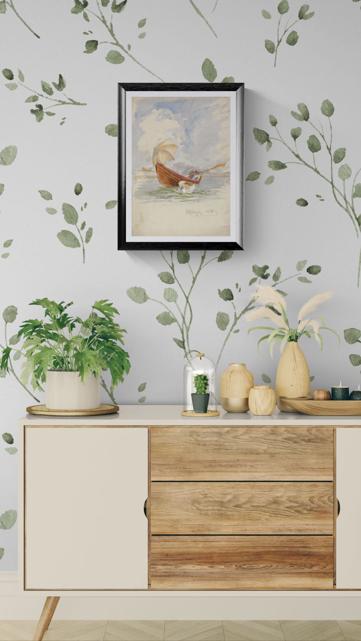 Wooden cabinet with decorative items against a wall with leafy patterns