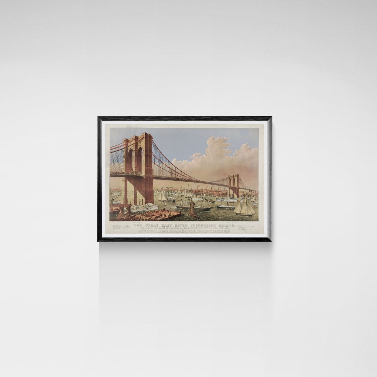 Framed print of the Brooklyn Bridge on a white wall