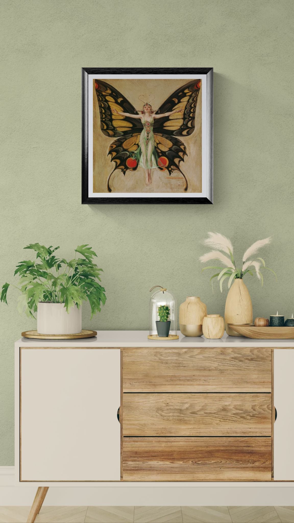 Framed butterfly artwork above a wooden cabinet with decorative items.