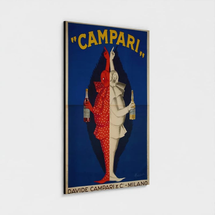 A vertical framed vintage-style poster reading "CAMPARI" with two stylized figures split down the middle, one red and one white, each holding a bottle, on a light gray background.