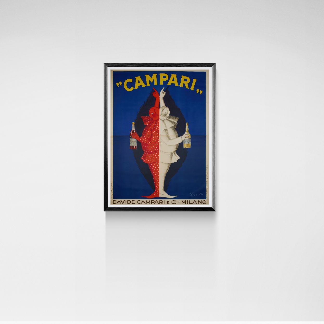 Framed Campari advertisement on a white wall