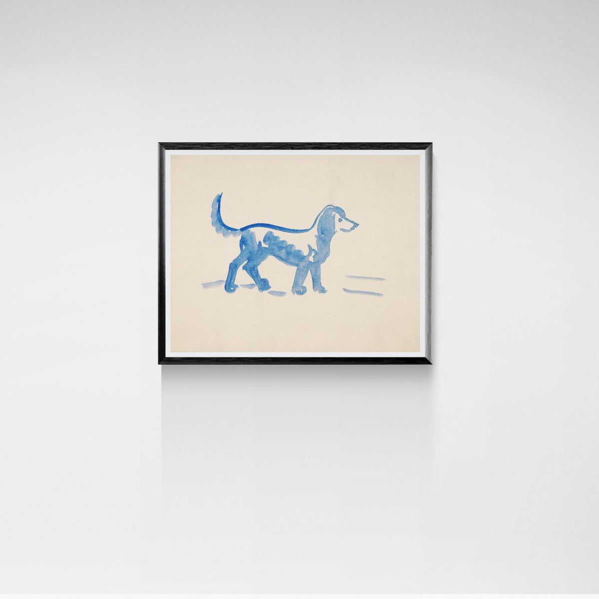 Framed artwork of a blue dog illustration on a beige background