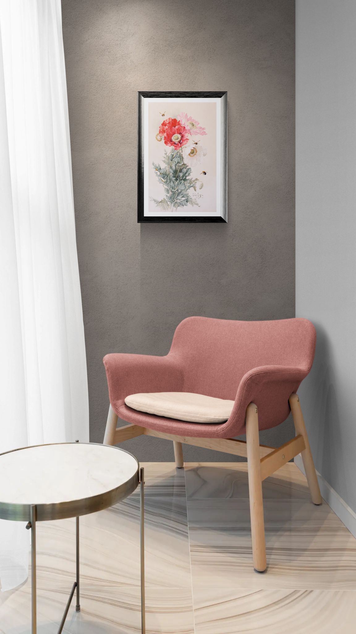 Pink chair with beige cushion in a room with a framed picture on the wall.