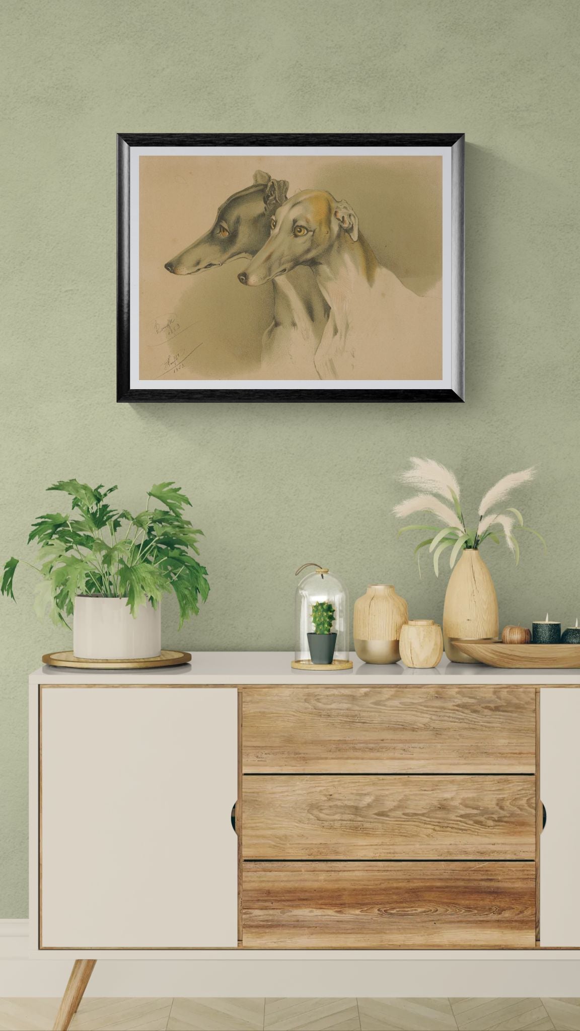 Framed artwork of a dog on a wall above a wooden cabinet with decorative items.